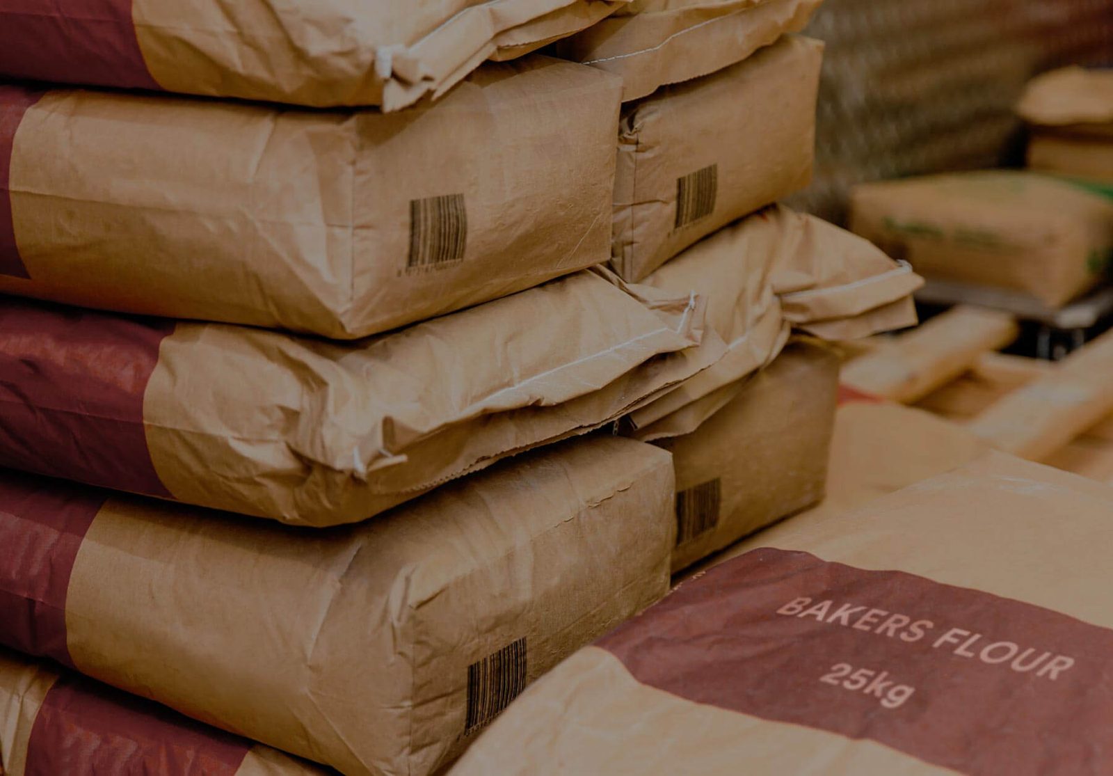 Stacked multi-wall paper sacks